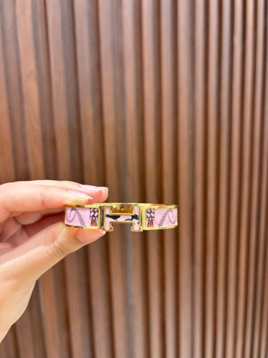 Pink patterned hermes bracelet